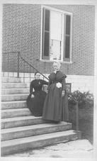 SA0048 - Sister Mary was of the West family and Sister Mary Settles was of the Centre family. They are identified on reverse; also, two women on "office steps."